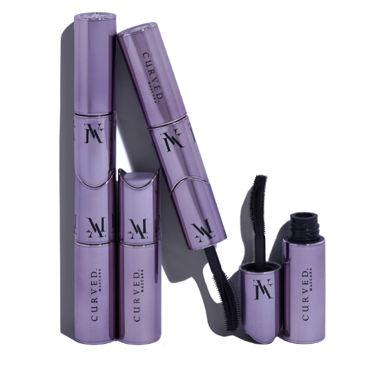 Picture of a woman holding three Mascara's by Mina AlSheikhly